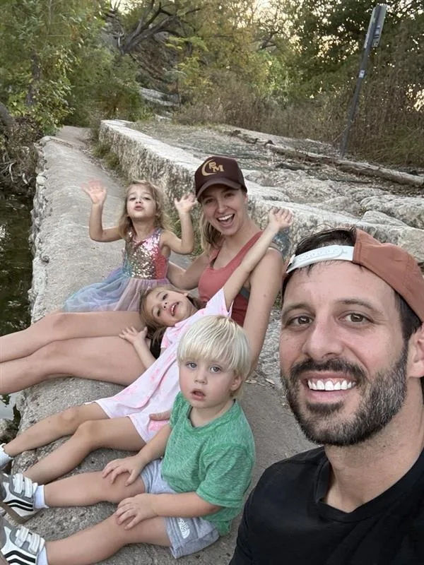 Adam with his wife and kids on a Hill Country hike