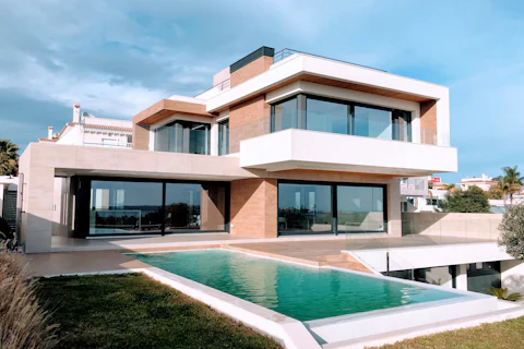 Contemporary home with broad windows and a pool